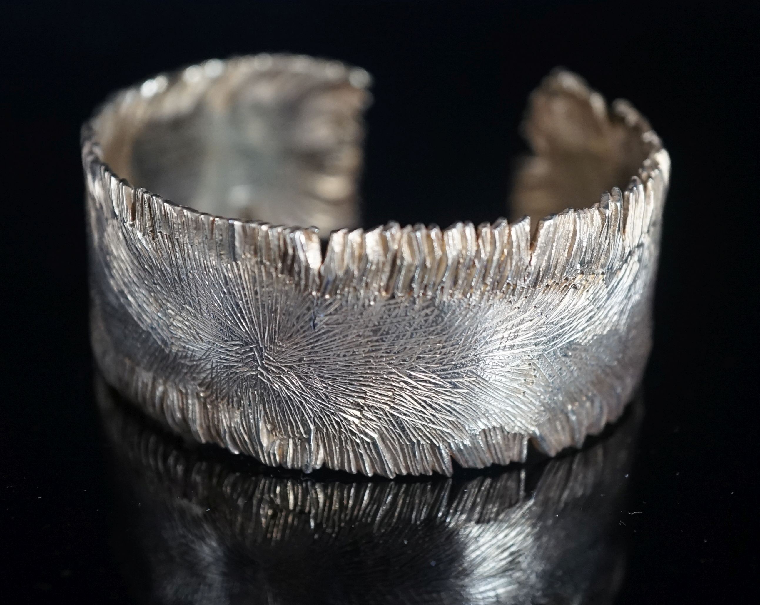 A modern silver gilt open bangle by Adrian Gerald Benney, London, 1962, with samorodok decoration, in original box, interior diameter approx. 60mm, 48 grams.